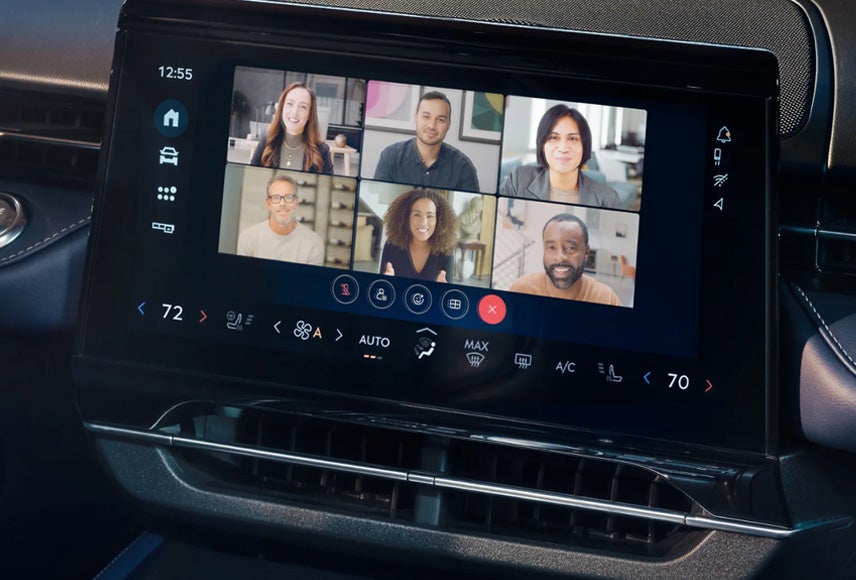 A Ford vehicle technology screen displaying a Webex video conferencing call with others. Screen may vary.